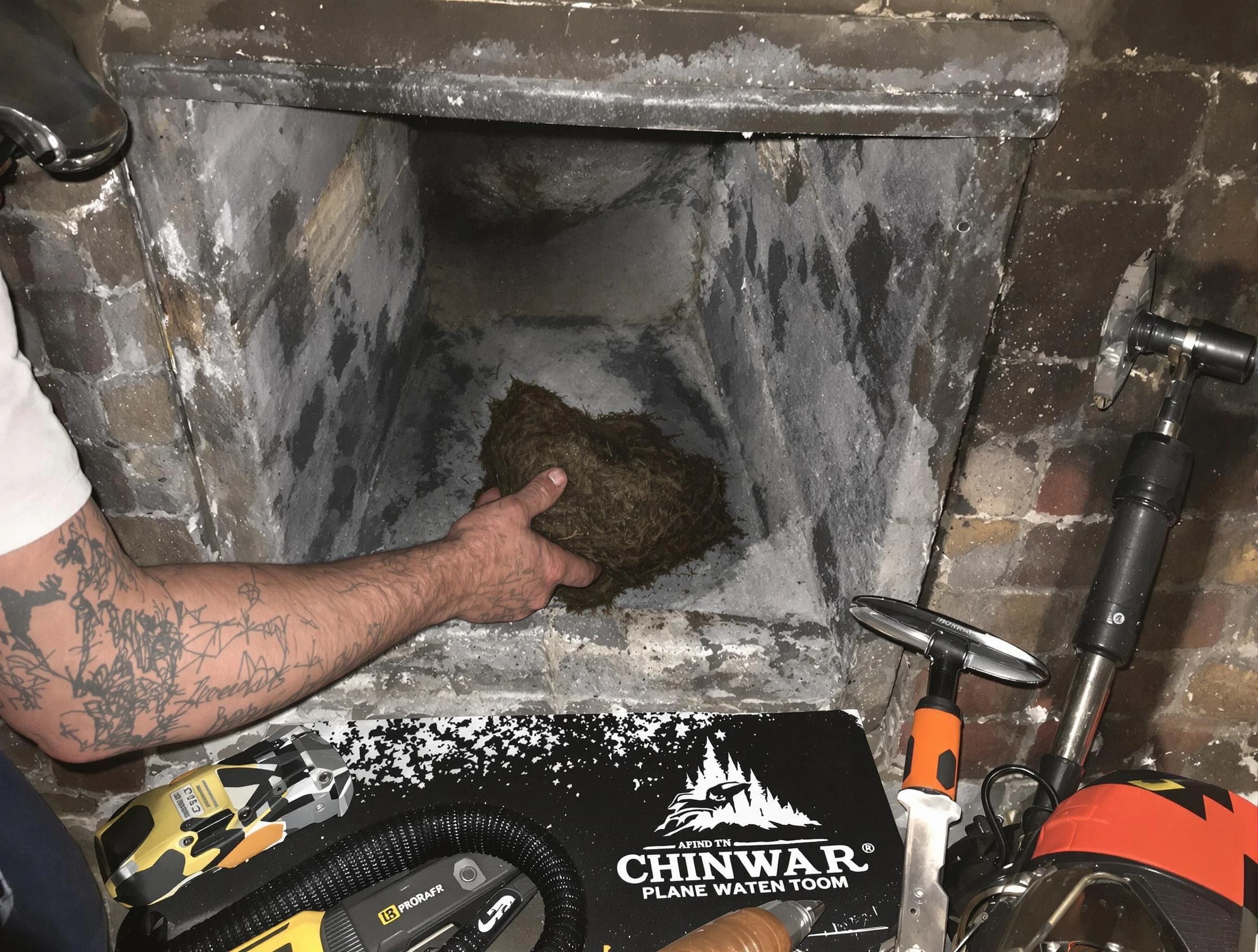 Wyndham Chimney Sweep safely removing debris and screening chimney in Wyndham, VA
